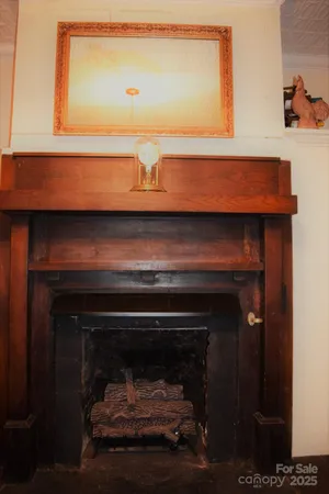 a living room with patio furniture and a floor to ceiling window