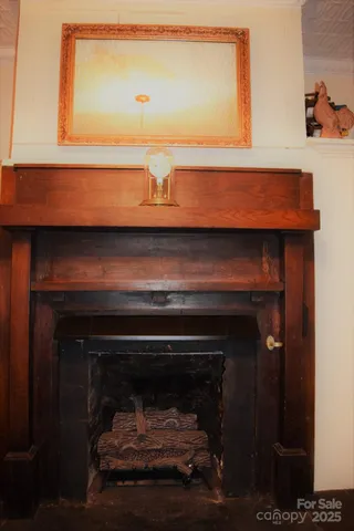 a living room with patio furniture and a floor to ceiling window