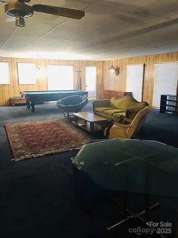 a view of a hallway with wooden floor and front door