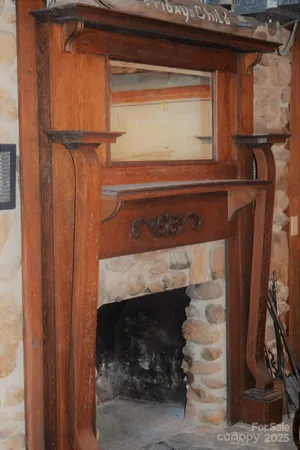 a living room with fireplace furniture and a fireplace