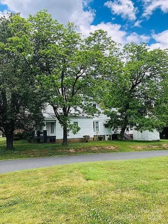 a view of swimming pool is middle and garden