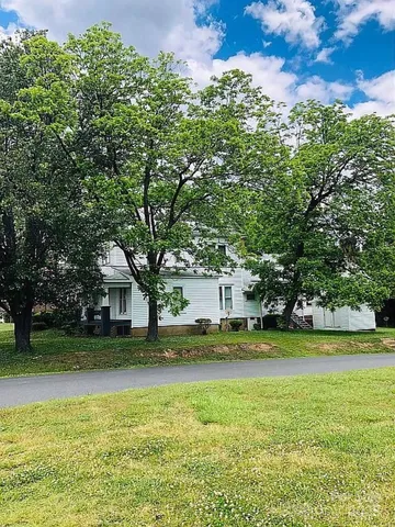 a view of swimming pool is middle and garden