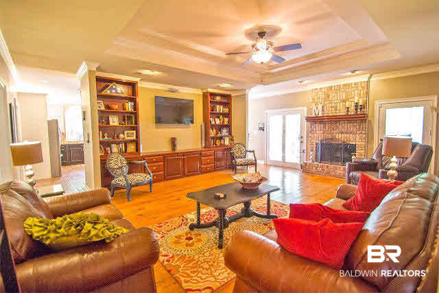 french doors lead to screened in porch.
