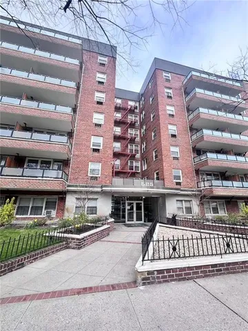 a lobby with furniture and a table