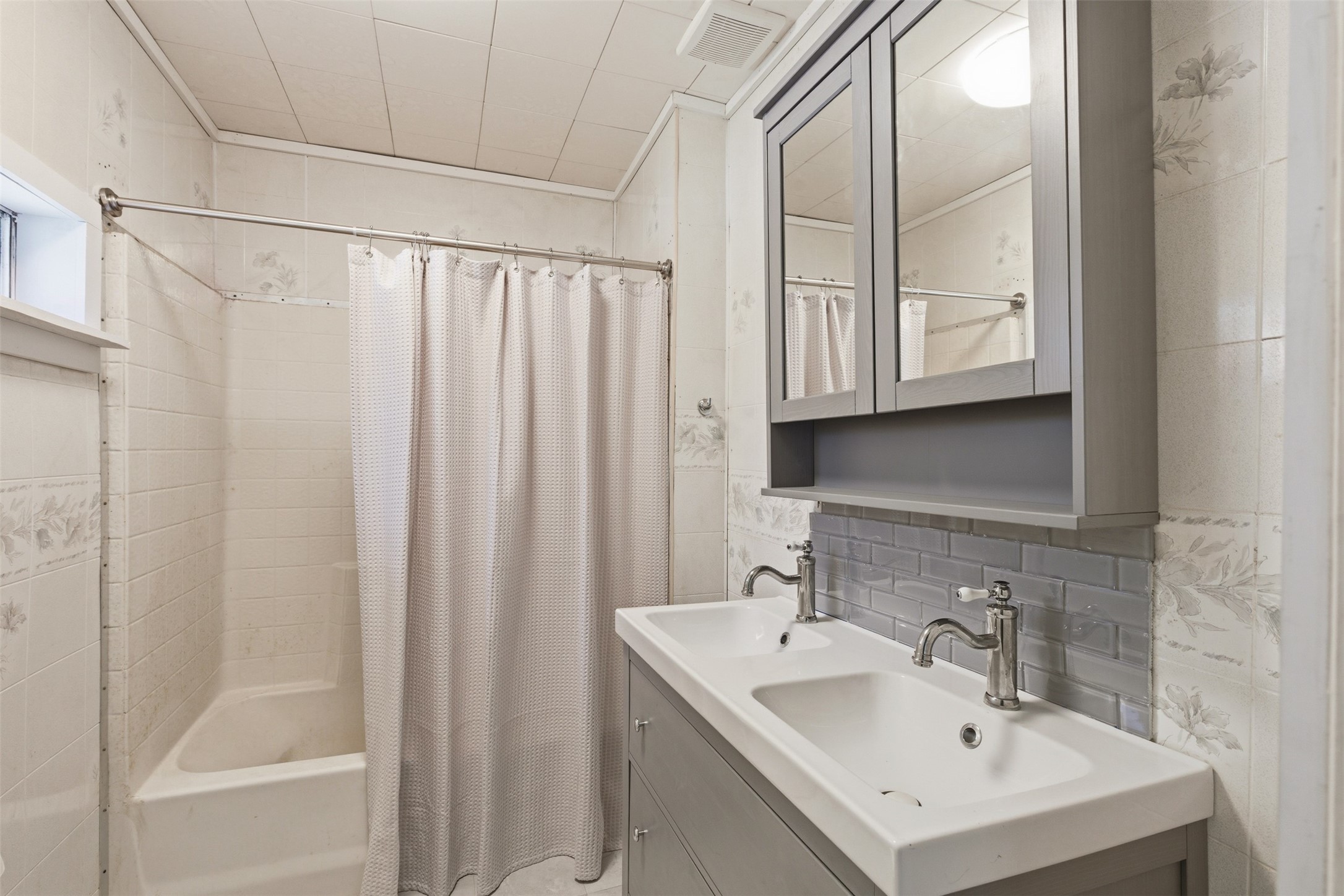 1310 Brazos Street Hempstead, TX 77445 - Photo 13 of 32 a bathroom with a sink a mirror and a shower