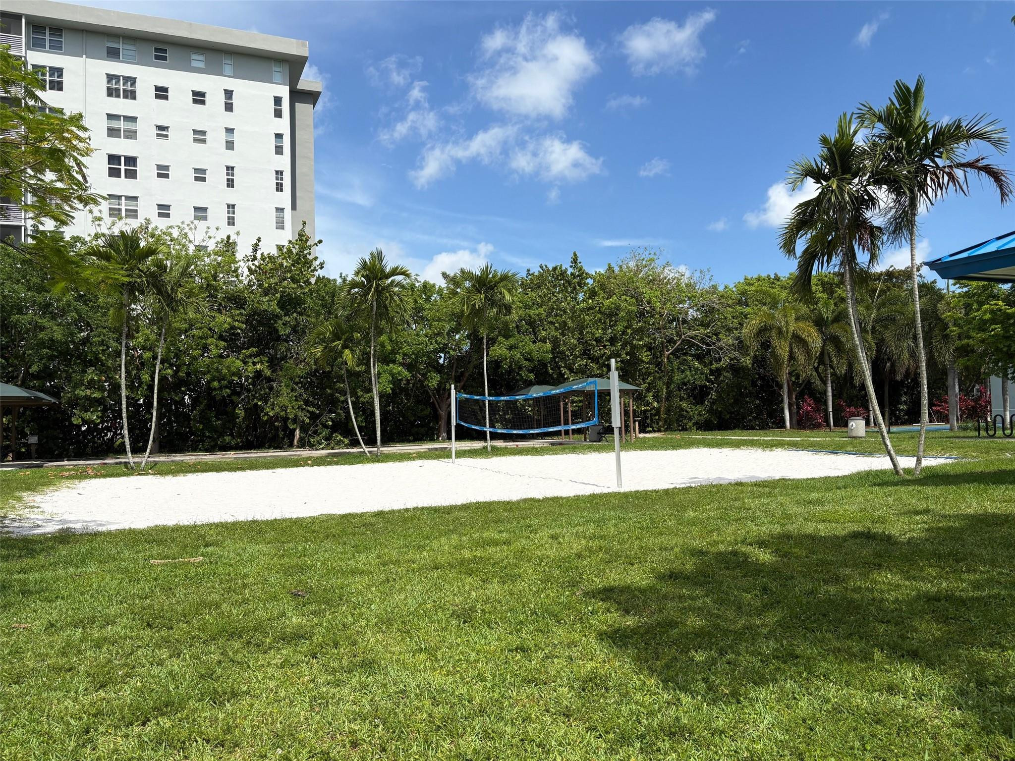 2671 South Course Drive, Unit 108 Pompano Beach, FL 33069 - Photo 34 of 40 a view of a green field with a house