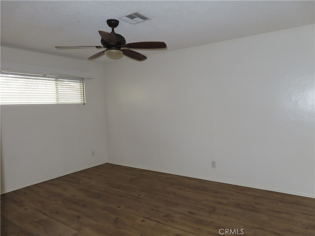 4041 MacArthur Road Riverside, CA 92503 - Photo 11 of 13 a view of empty room with wooden floor