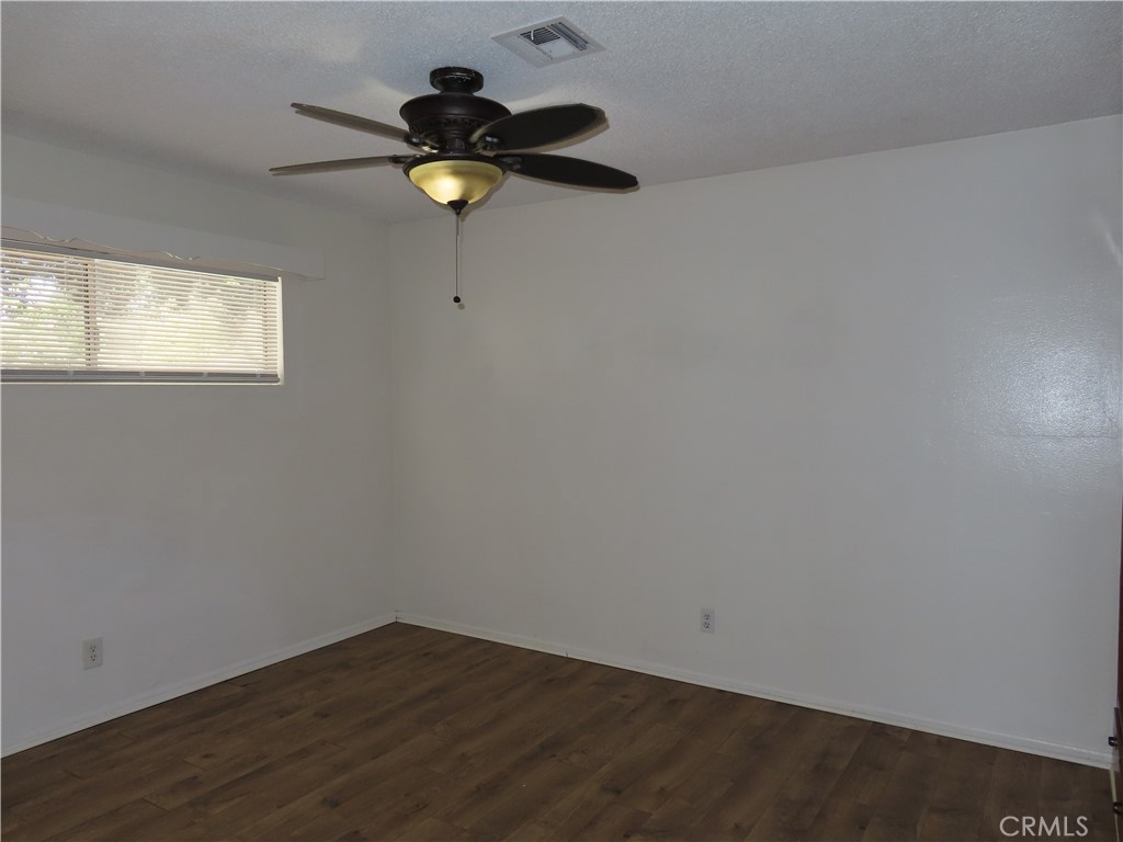 4041 MacArthur Road Riverside, CA 92503 - Photo 12 of 13 a view of empty room with wooden floor