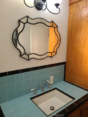 a bathroom with a toilet a sink and a window