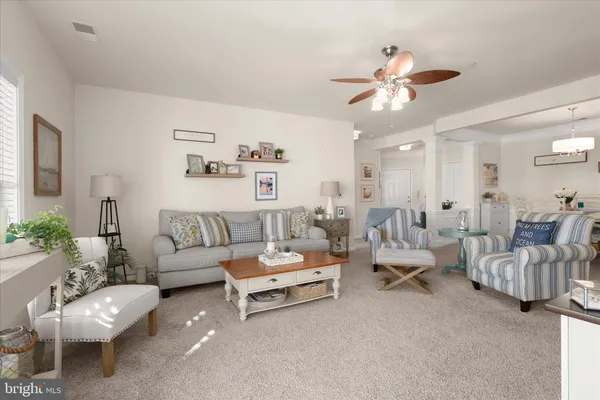 a living room with furniture or couch and a large window