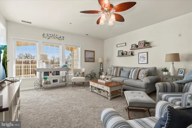 a kitchen with stainless steel appliances granite countertop a refrigerator sink and stove