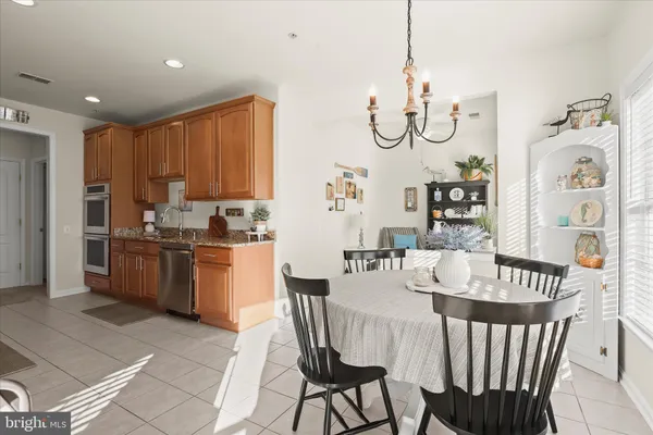 a view of a dining room with furniture and window