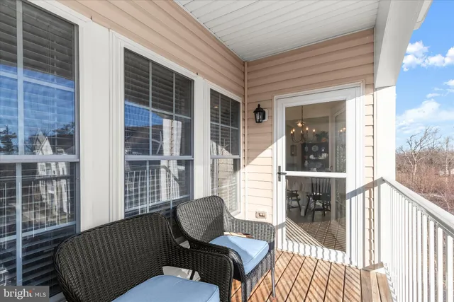 a view of a balcony with furniture