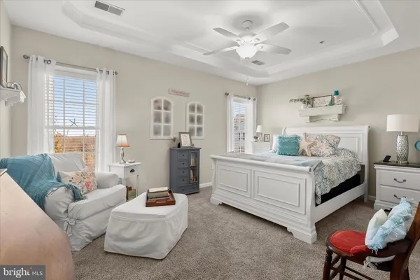 a bathroom with a sink a mirror and a shower