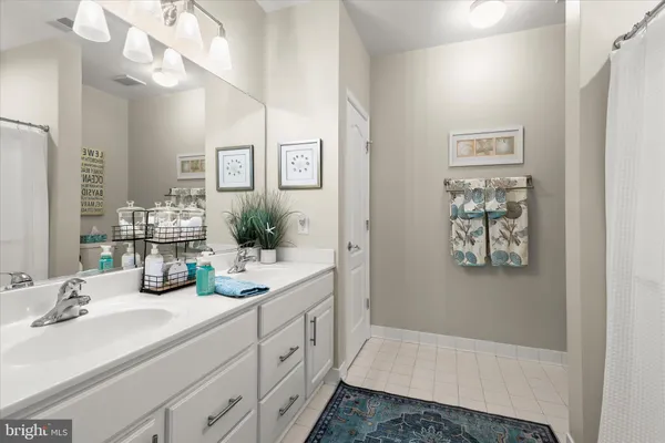 a spacious bedroom with a bed and a window