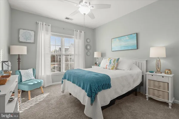 a bedroom with a bed and a table