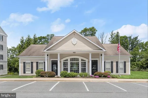 a view of a dining room with furniture and window
