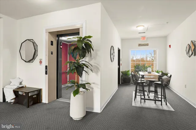 a dining room with furniture and entryway