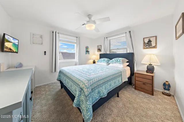 a view of a bedroom with washer and dryer