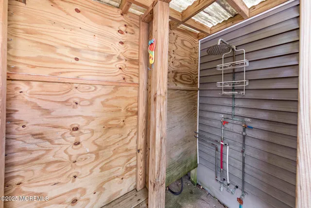 a view of a balcony with wooden floor and outdoor space