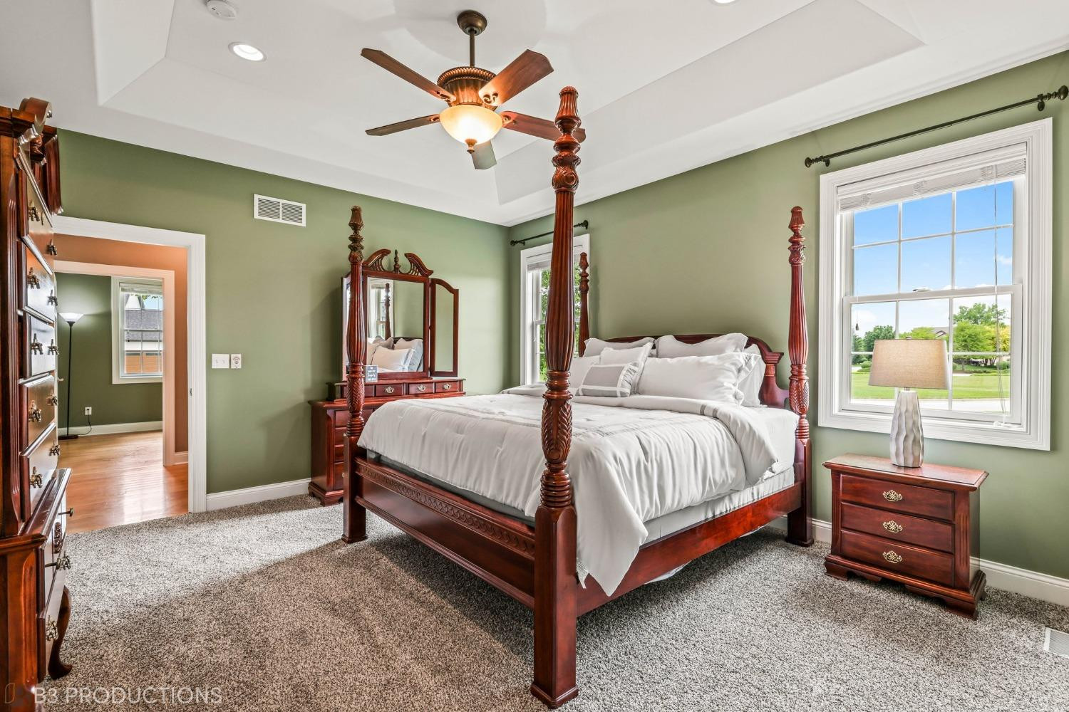 1825 Bramble Trace Chesterton, IN 46304 - Photo 14 of 30 a spacious bedroom with a bed and a chandelier