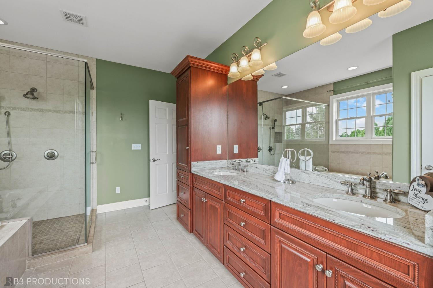 1825 Bramble Trace Chesterton, IN 46304 - Photo 16 of 30 a bathroom with a sink double vanity and a shower