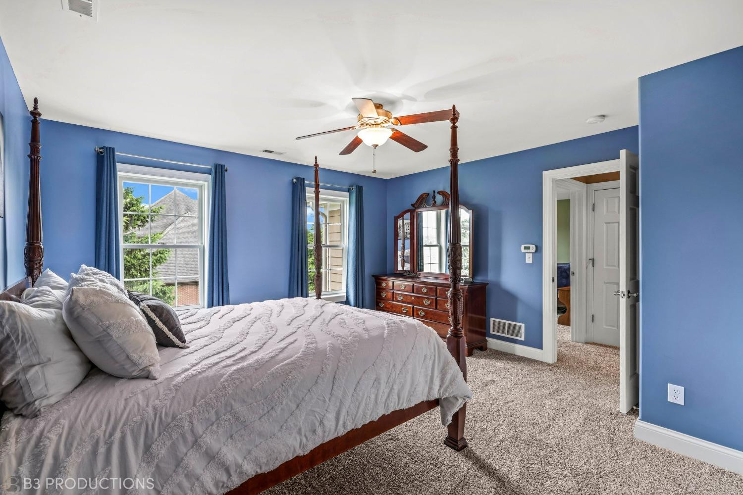 1825 Bramble Trace Chesterton, IN 46304 - Photo 18 of 30 a bedroom with a bed and a chandelier
