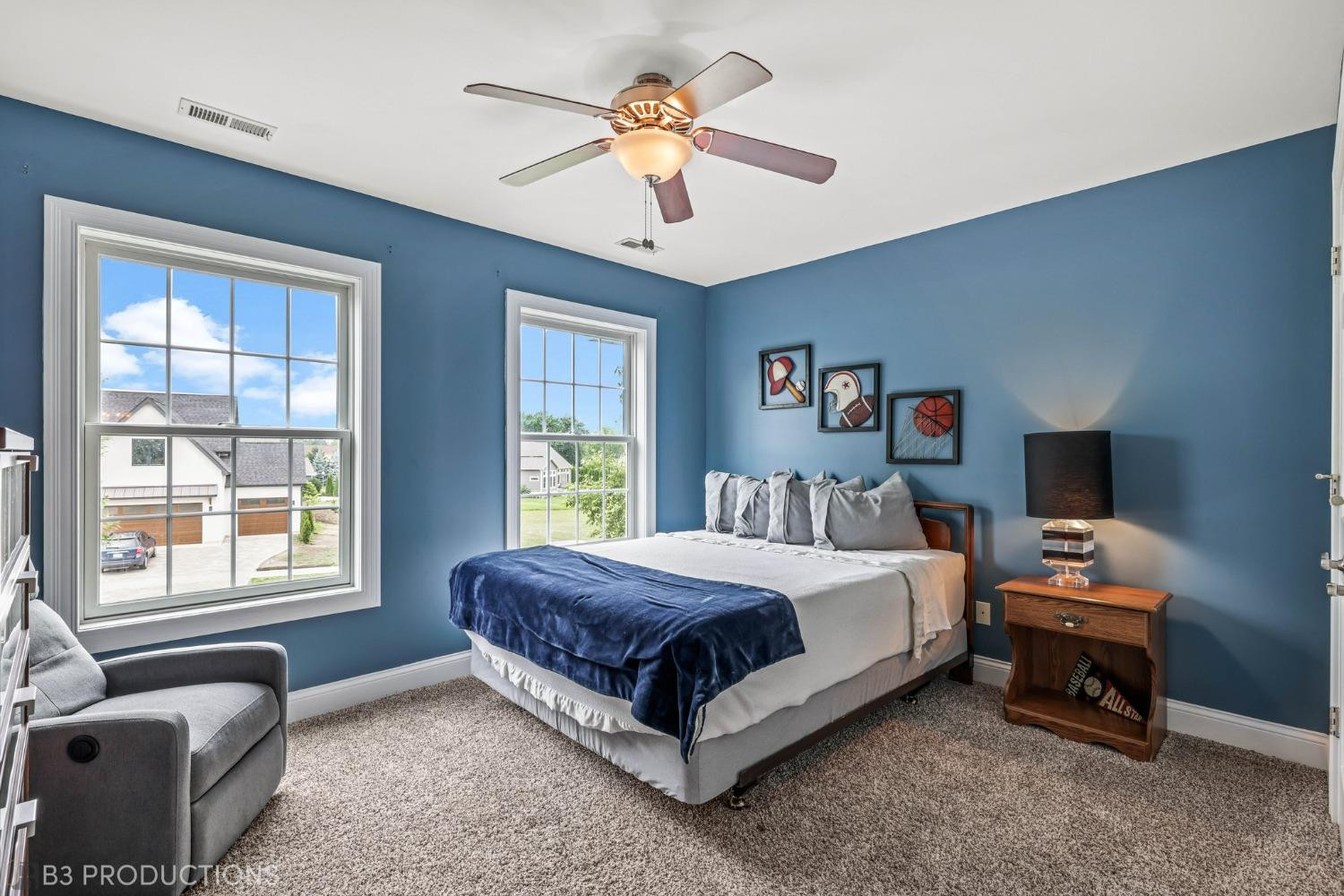 1825 Bramble Trace Chesterton, IN 46304 - Photo 22 of 30 a bedroom with a bed and a chandelier