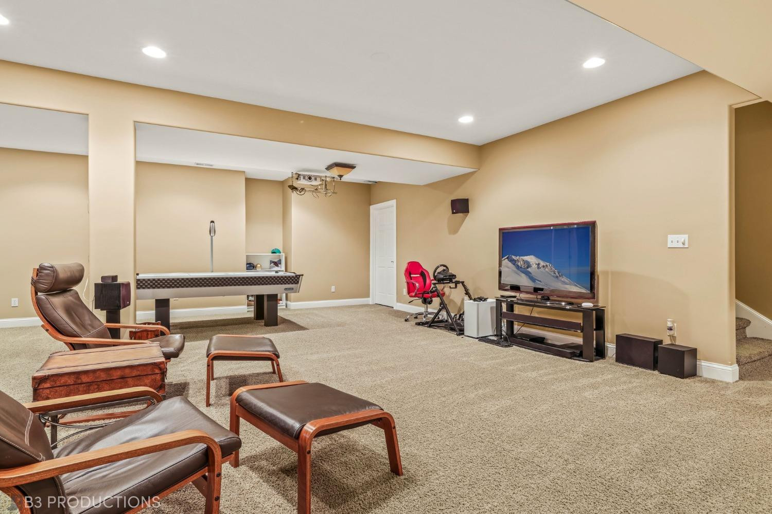 1825 Bramble Trace Chesterton, IN 46304 - Photo 24 of 30 a living room with furniture a flat screen tv and a table
