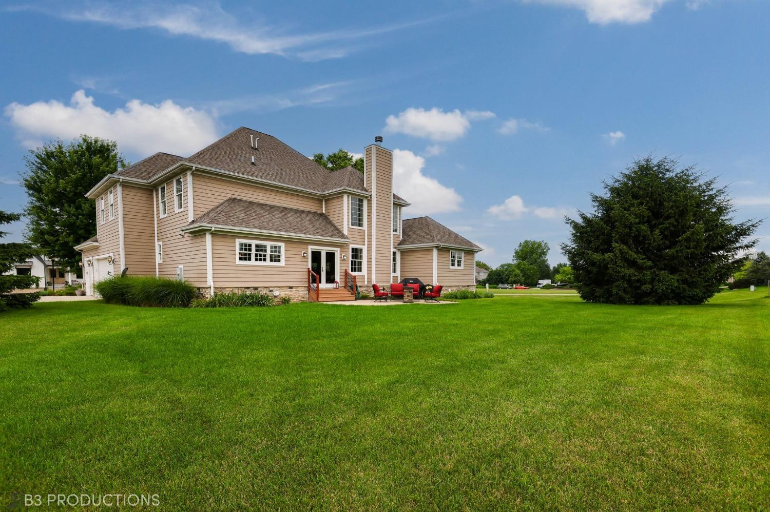 1825 Bramble Trace Chesterton, IN 46304 - Photo 28 of 30 a view of a white house with a big yard and large trees