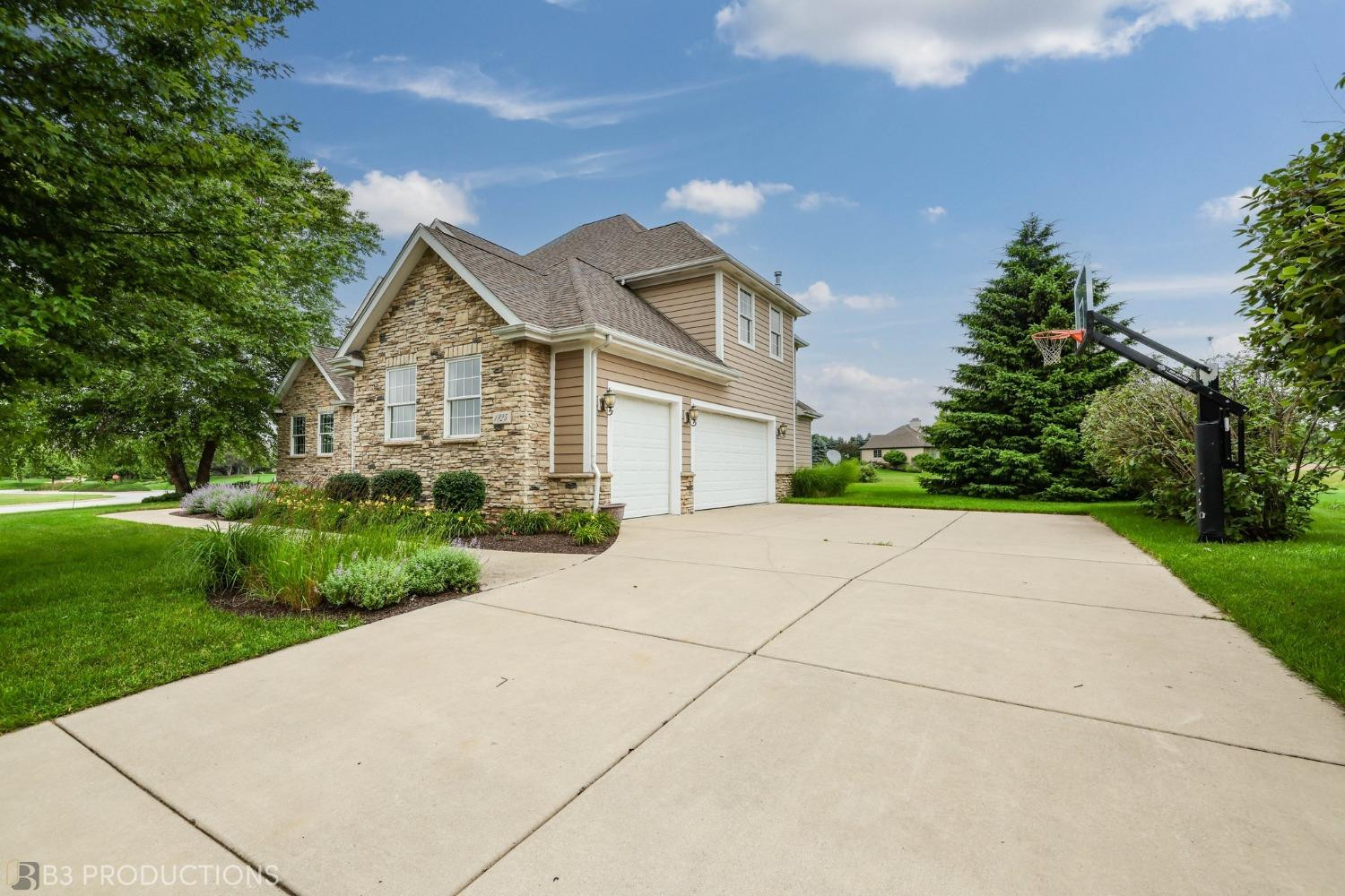 1825 Bramble Trace Chesterton, IN 46304 - Photo 30 of 30 a front view of a house with a yard and trees