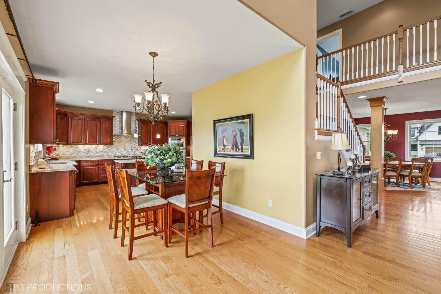 1825 Bramble Trace Chesterton, IN 46304 - Photo 8 of 30 a dining room with furniture a chandelier and wooden floor