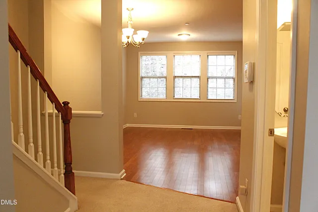 a view of an entryway with wooden floor