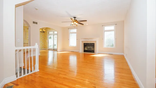 a bathroom with a granite countertop sink and a large mirror