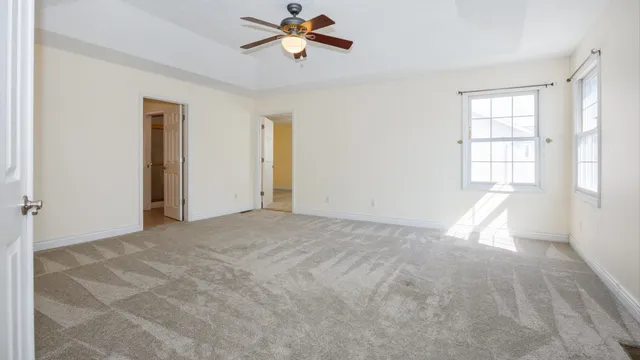 a living room with a couch and a window