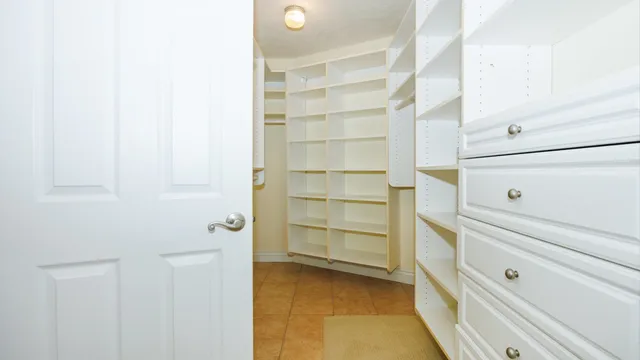 an empty room with windows and entrance