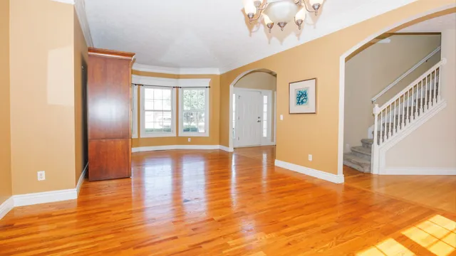 a view of a dining room with furniture and wooden floor
