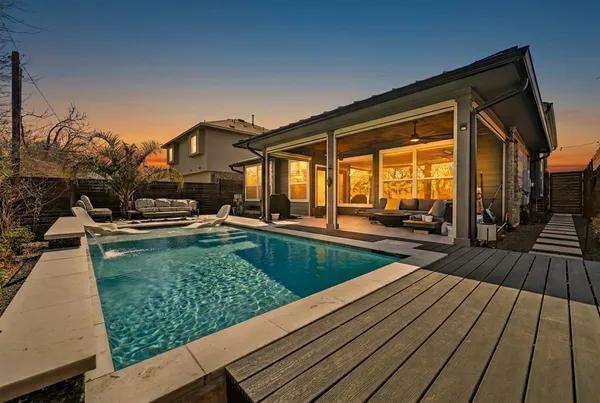 a view of a swimming pool with a patio