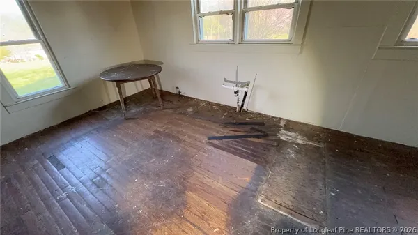 a view of a house with a yard chairs and a fire pit