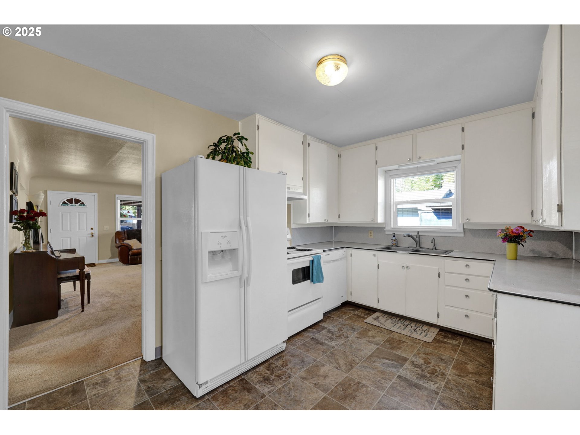 1441 6th Street Springfield, OR 97477 - Photo 13 of 48 a kitchen with white cabinets and white appliances