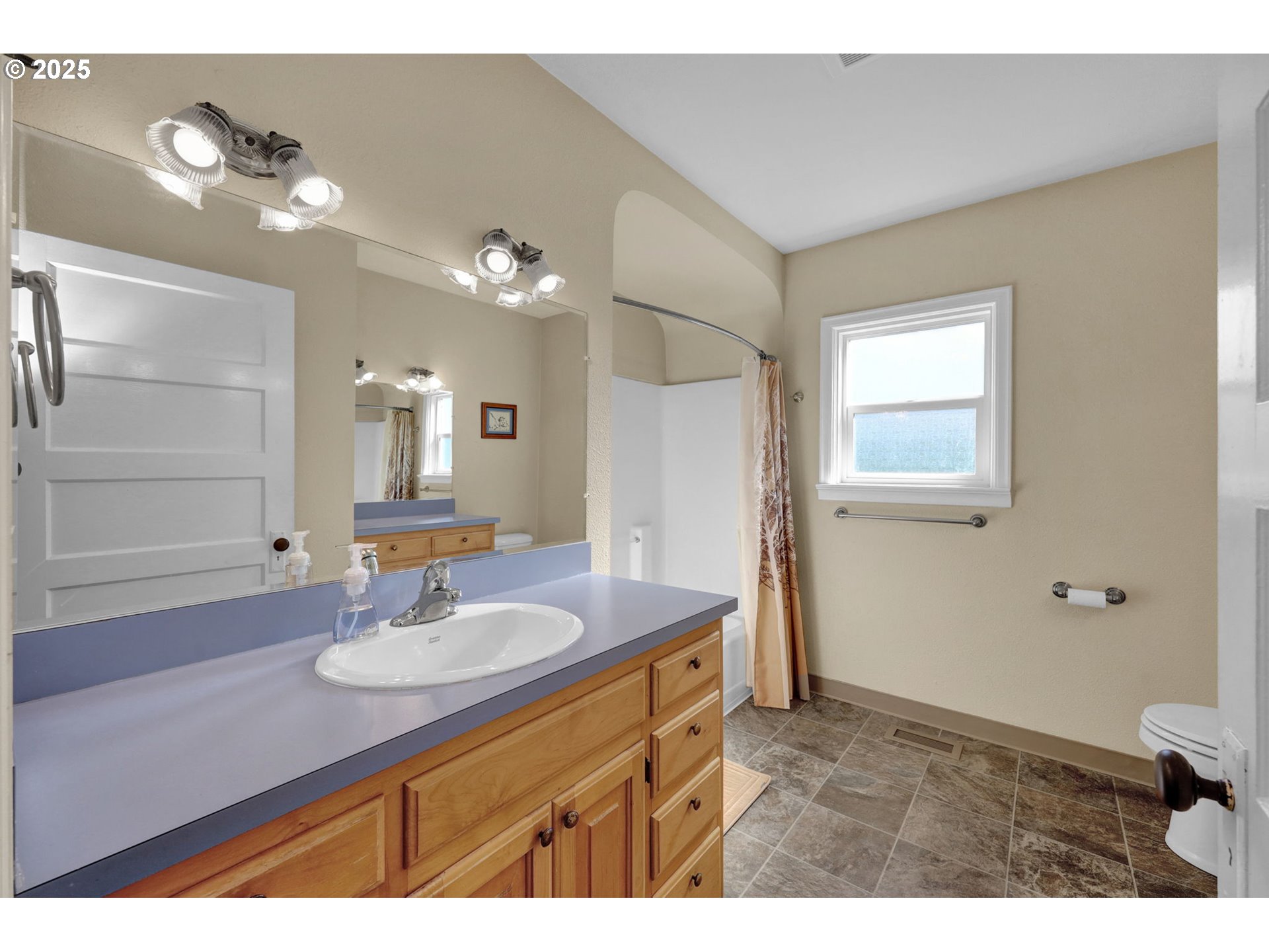 1441 6th Street Springfield, OR 97477 - Photo 20 of 48 a bathroom with a sink double vanity and a mirror