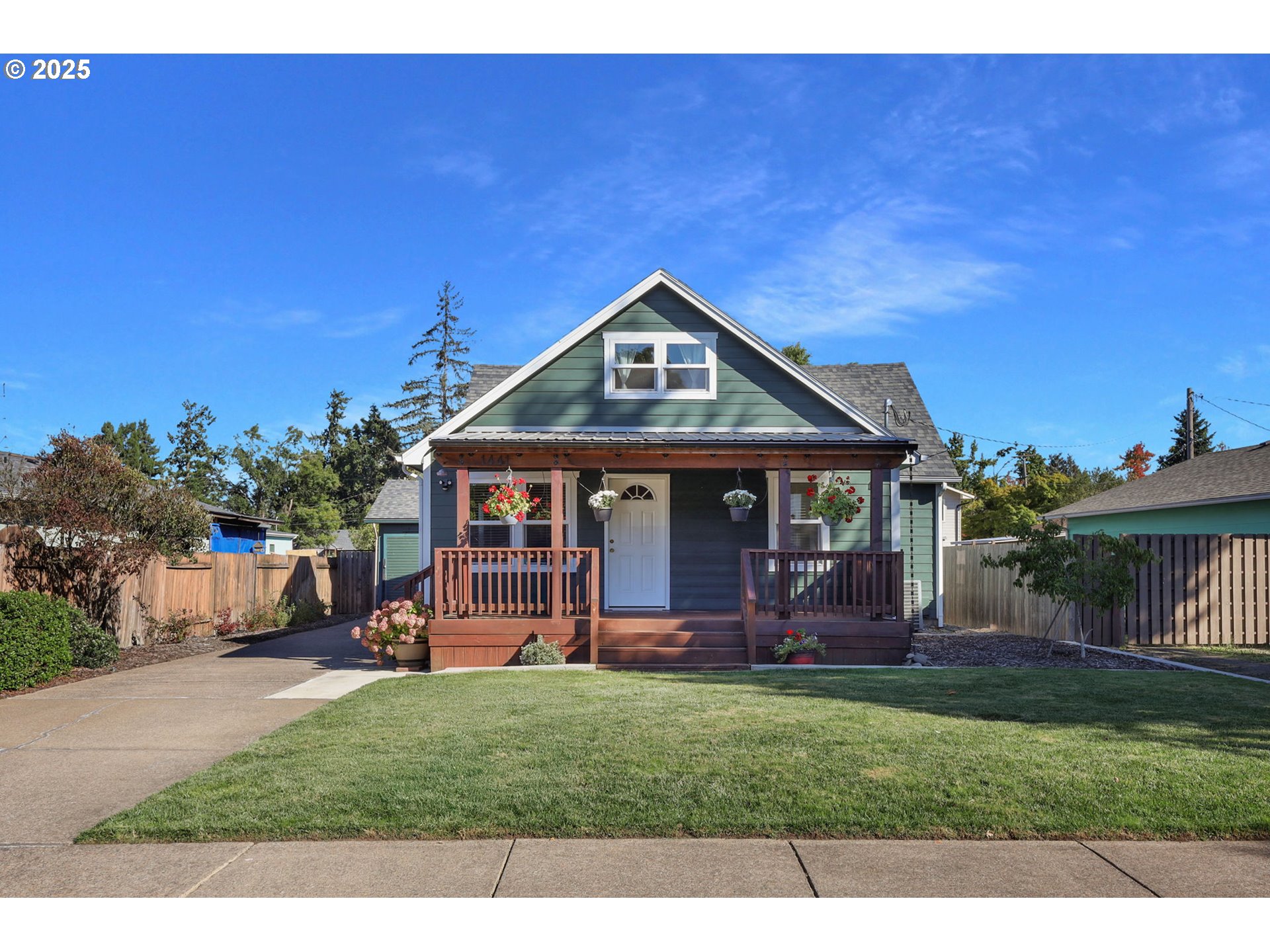 1441 6th Street Springfield, OR 97477 - Photo 2 of 48 a front view of a house with garden