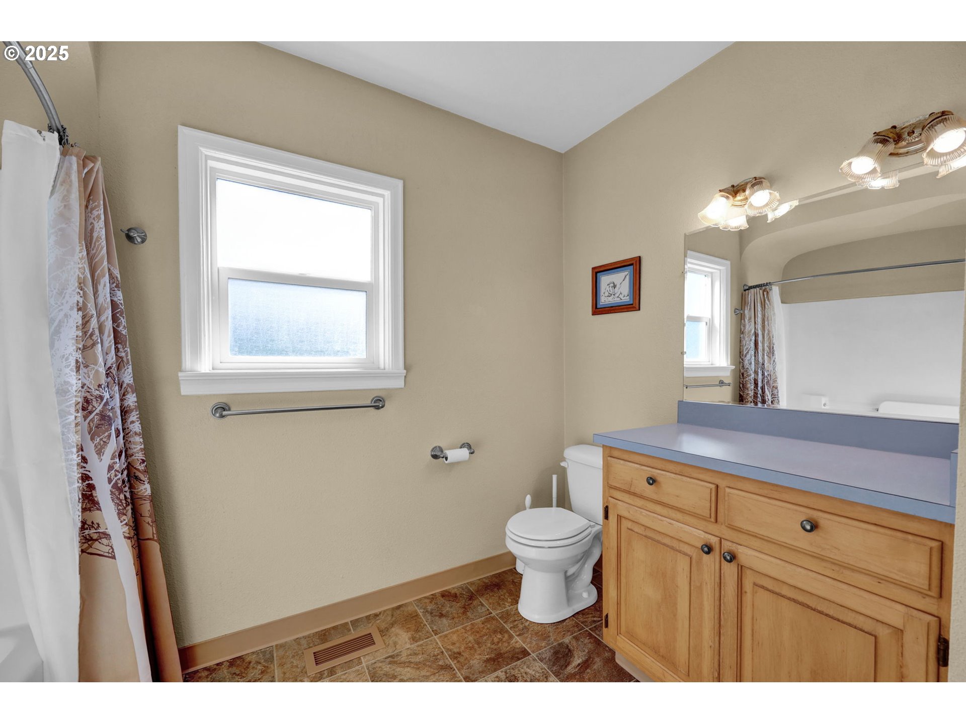 1441 6th Street Springfield, OR 97477 - Photo 21 of 48 a bathroom with a toilet sink and mirror