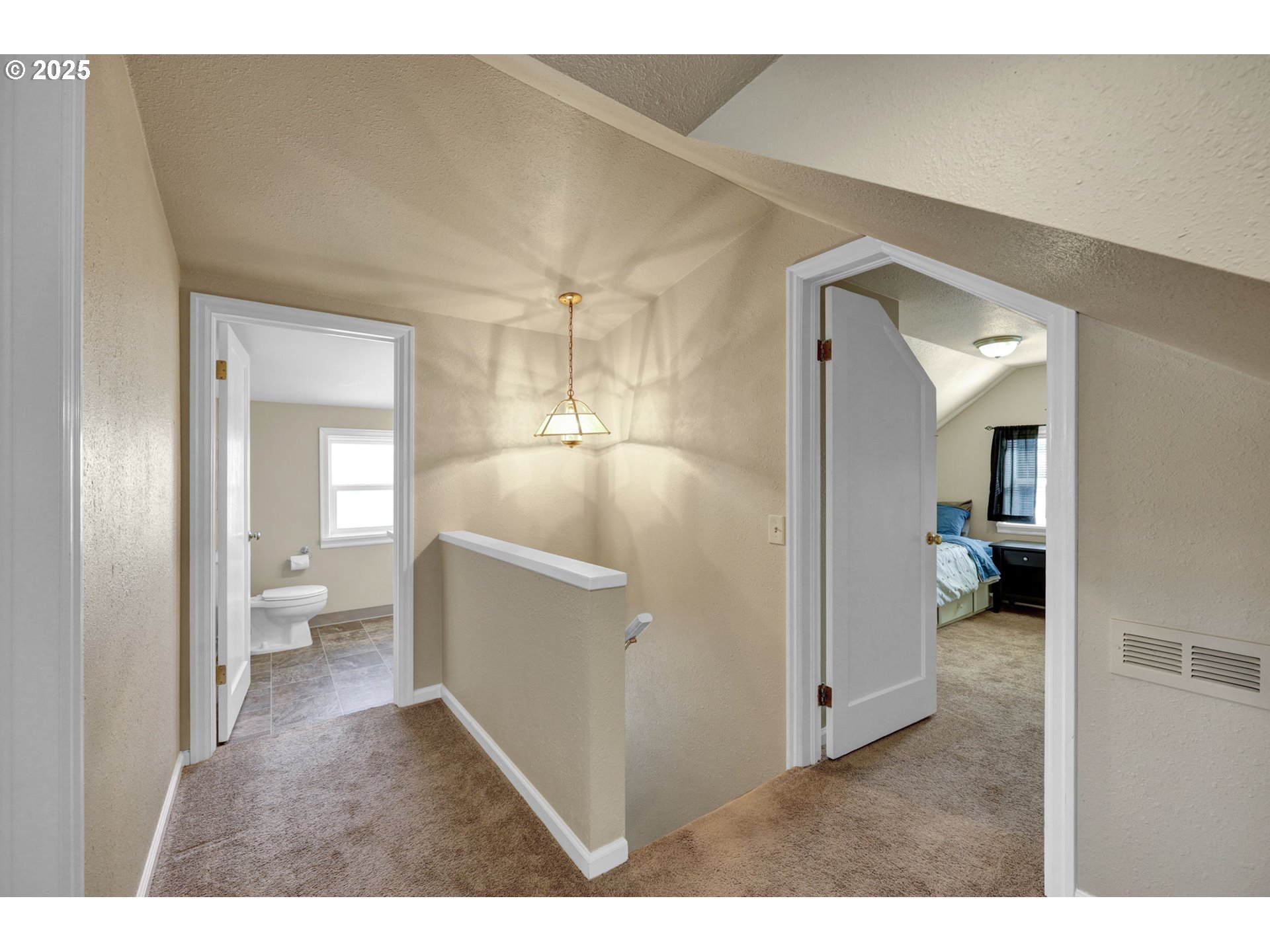 1441 6th Street Springfield, OR 97477 - Photo 25 of 48 a view of a hallway with bathroom and wooden floor