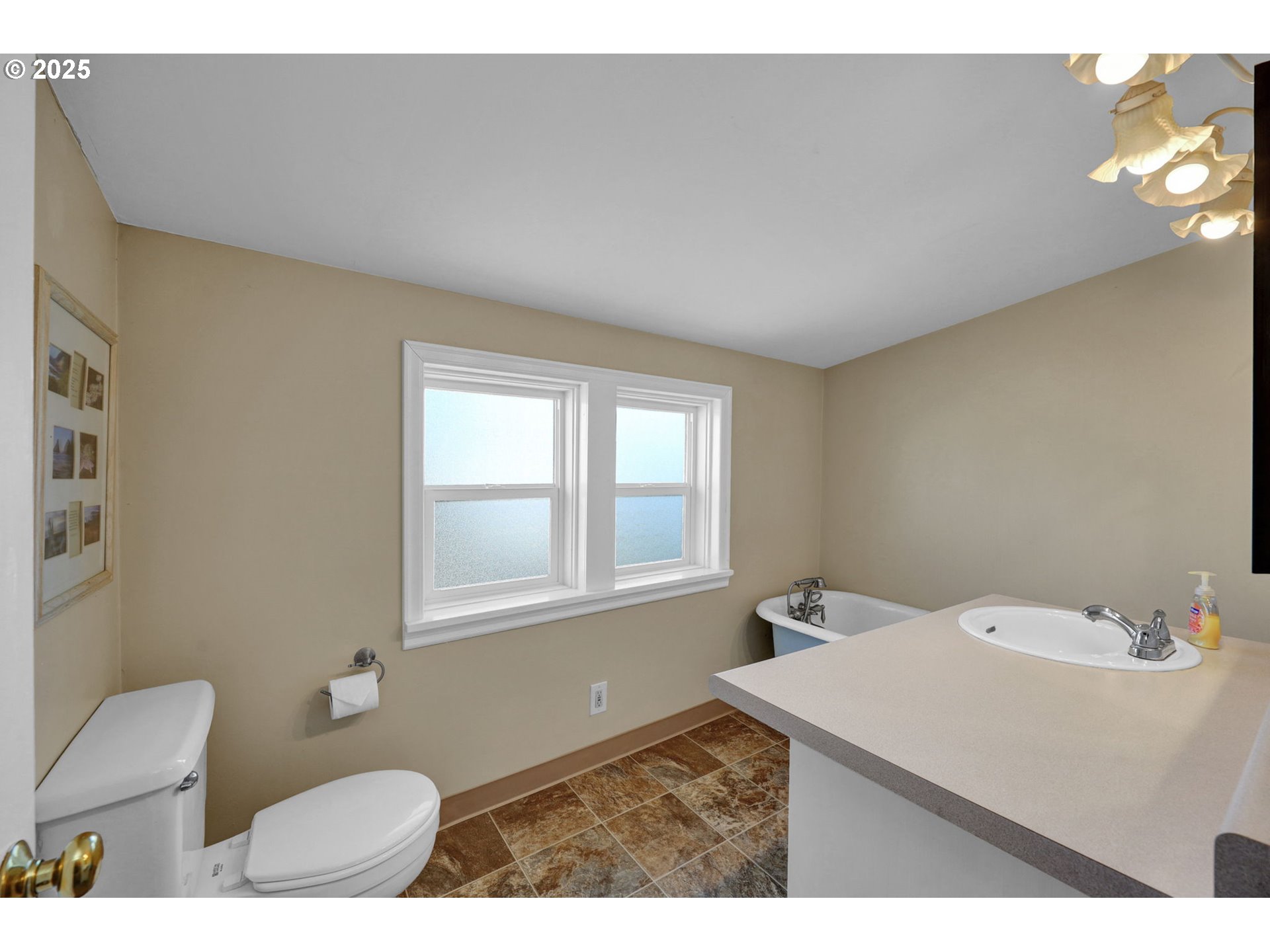 1441 6th Street Springfield, OR 97477 - Photo 26 of 48 a bathroom with a sink toilet and window