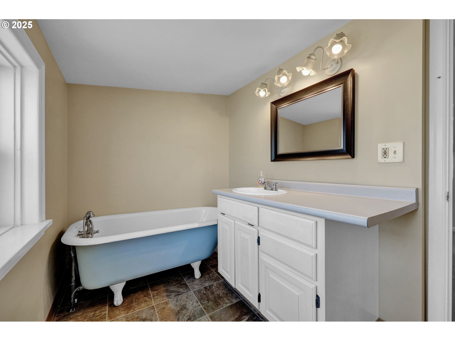1441 6th Street Springfield, OR 97477 - Photo 27 of 48 a bathroom with a sink a mirror and a toilet