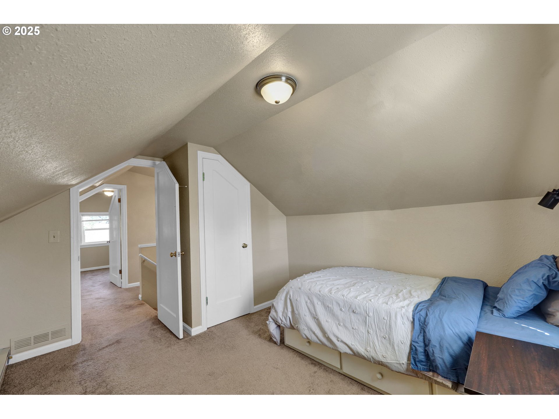 1441 6th Street Springfield, OR 97477 - Photo 30 of 48 a bedroom with a bed and cabinets