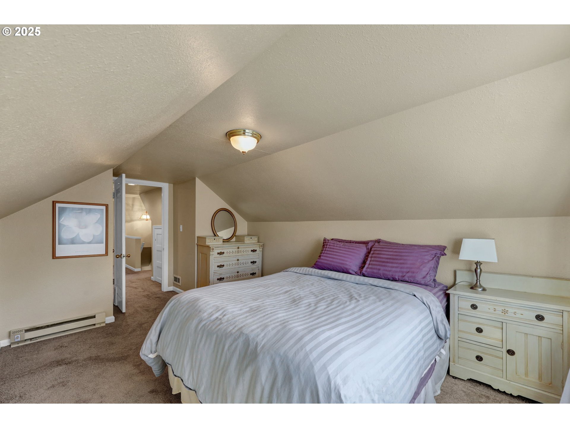 1441 6th Street Springfield, OR 97477 - Photo 35 of 48 a bedroom with a bed and a night stand