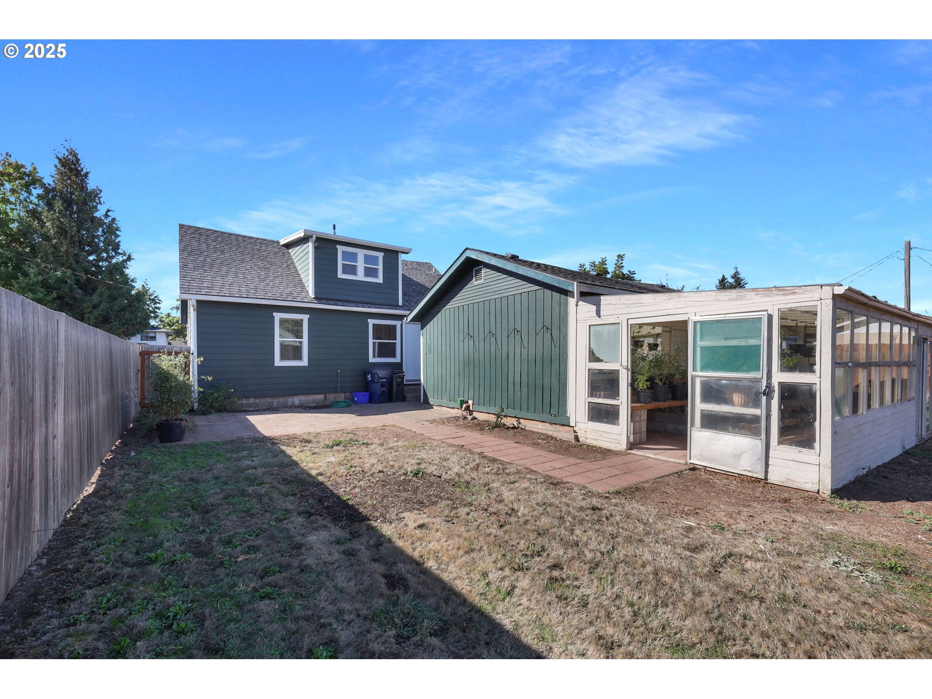 1441 6th Street Springfield, OR 97477 - Photo 40 of 48 a view of a house with a yard and wooden fence