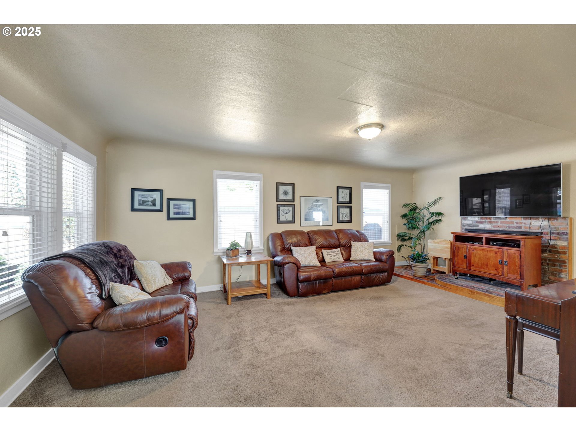 1441 6th Street Springfield, OR 97477 - Photo 5 of 48 a living room with furniture and a flat screen tv
